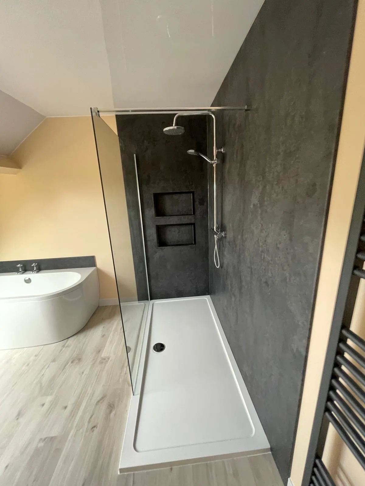 Walk-in shower with marble effect wall panels installed in Tywyn